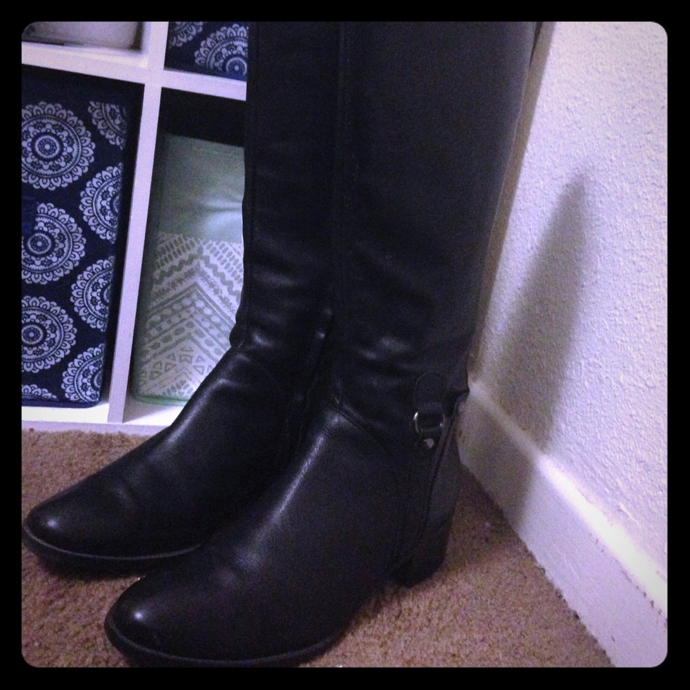 Bold black boots with a silver design.